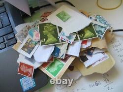 Unfranked uk stamps on paper only APPROX £600 face value + special delivery